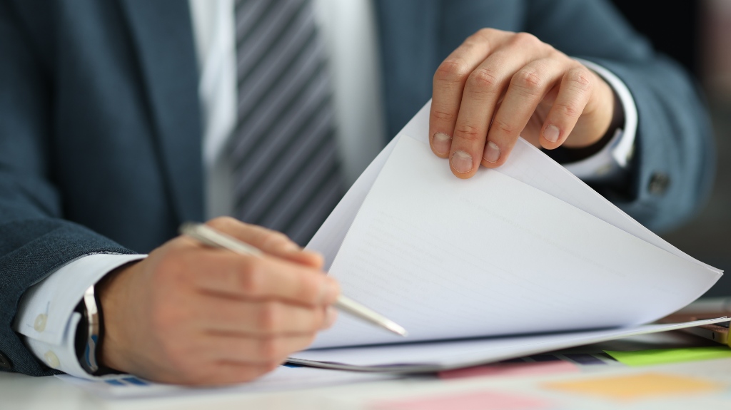 lawyer sorts through clients' documents