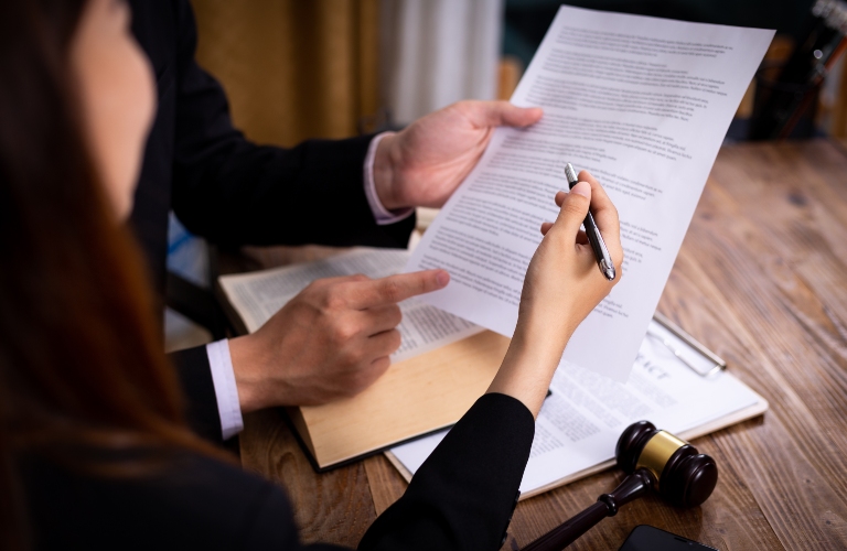 client and lawyer reviewing contract
