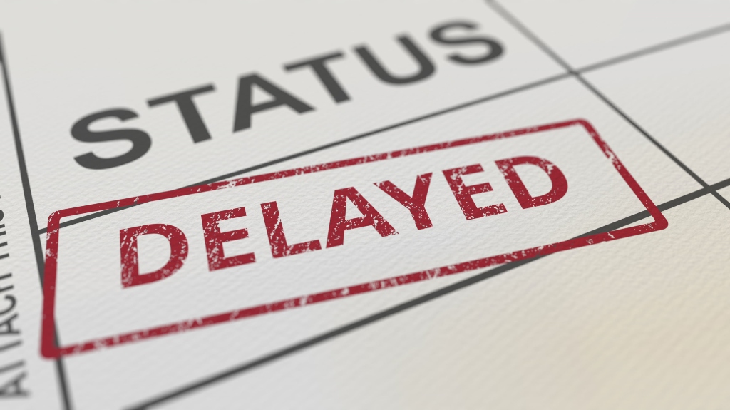 Red DELAYED stamp on paper form